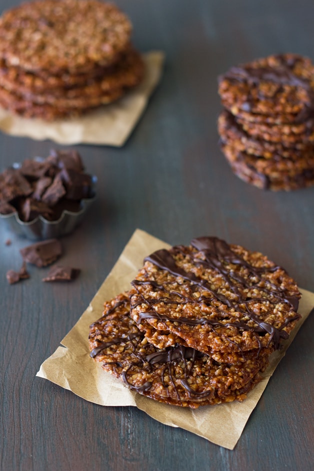 Dark Chocolate Almond Florentines  - Thin, crispy, and delicate lace cookies sandwiched and drizzled with bittersweet chocolate. | brighteyedbaker.com