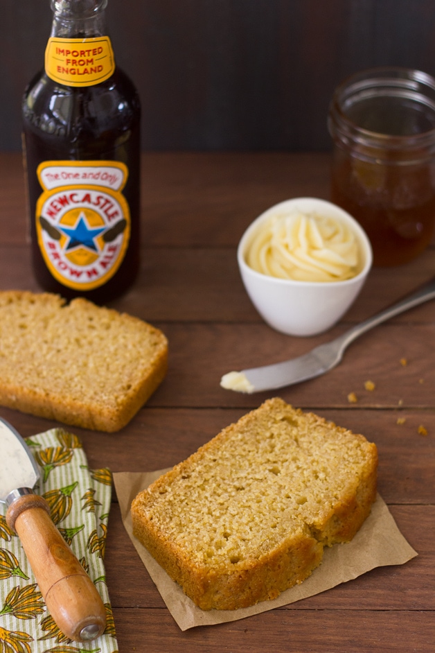 Honey and Beer Cornbread - a fusion of beer bread and cornbread that's tender and perfectly sweet, with crisp edges sweetened by an incredible honey butter glaze. Plus, it's super easy to make! | brighteyedbaker.com