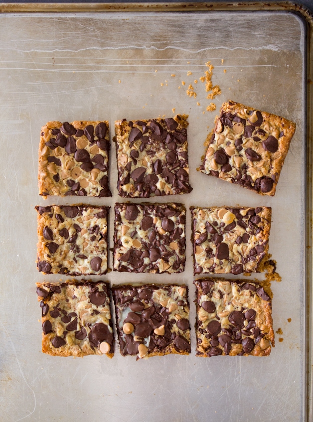 Peanut Butter Chocolate Chip Magic Bars - a peanut butter graham cracker cookie base layered with sweet and gooey sweetened condensed milk, chocolate chips, and peanut butter chips. A fast, easy, addicting dessert! | brighteyedbaker.com