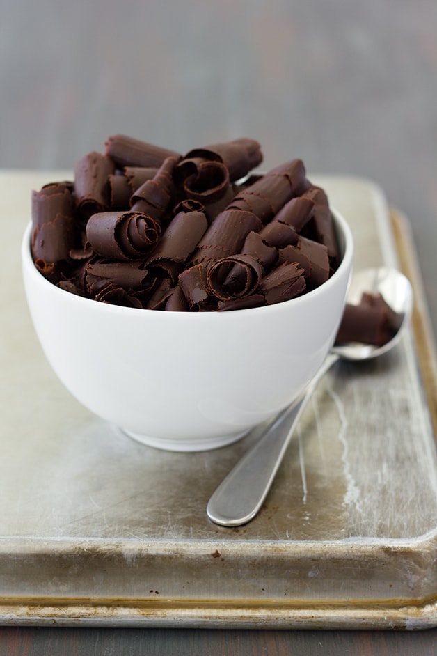 DIY Chocolate Curls - use two staple ingredients to make these gorgeous chocolate curls for garnishing desserts. | www.brighteyedbaker.com