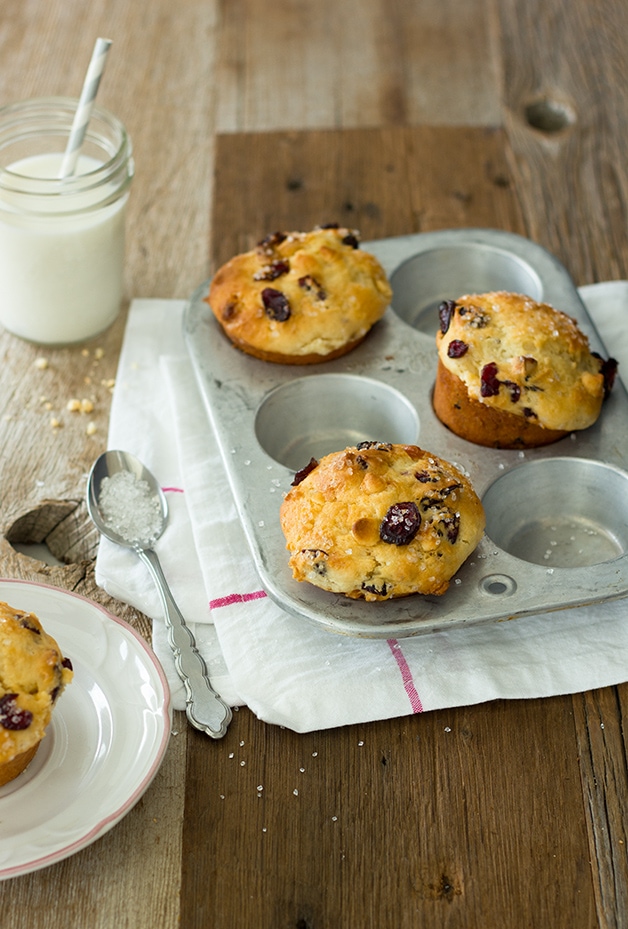 Cranberry White Chocolate Chip Muffins - Light and tender bakery-style muffins studded with tangy dried cranberries and sweet white chocolate chips. | www.brighteyedbaker.com
