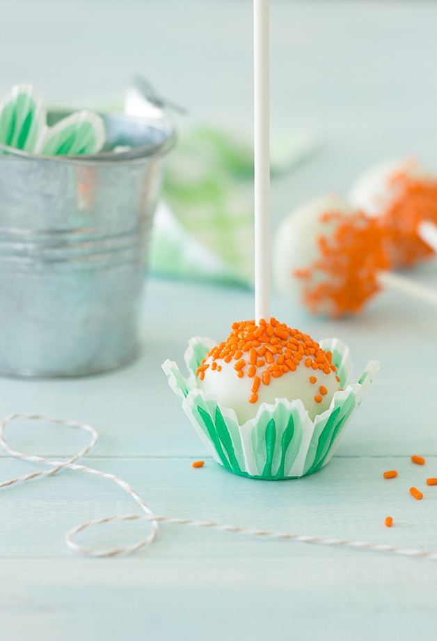 {From Scratch} Carrot Cake Pops - Spiced Carrot Cake mixed with Cream Cheese Frosting and coated in White Chocolate| www.brighteyedbaker.com