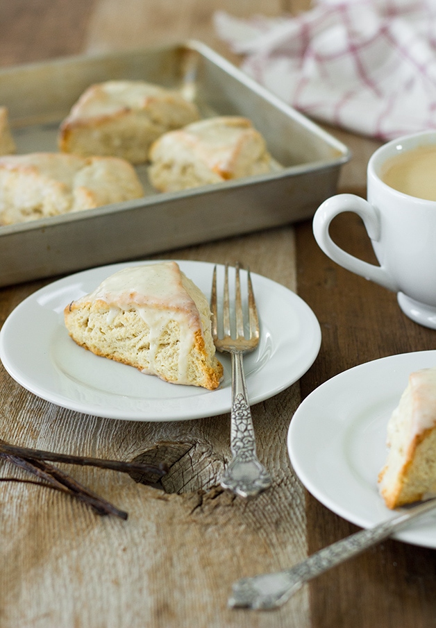 Vanilla Bean Scones | slightly crisp on the outside, tender on the inside, and topped with a sweet vanilla bean glaze for maximum flavor. | www.brighteyedbaker.com