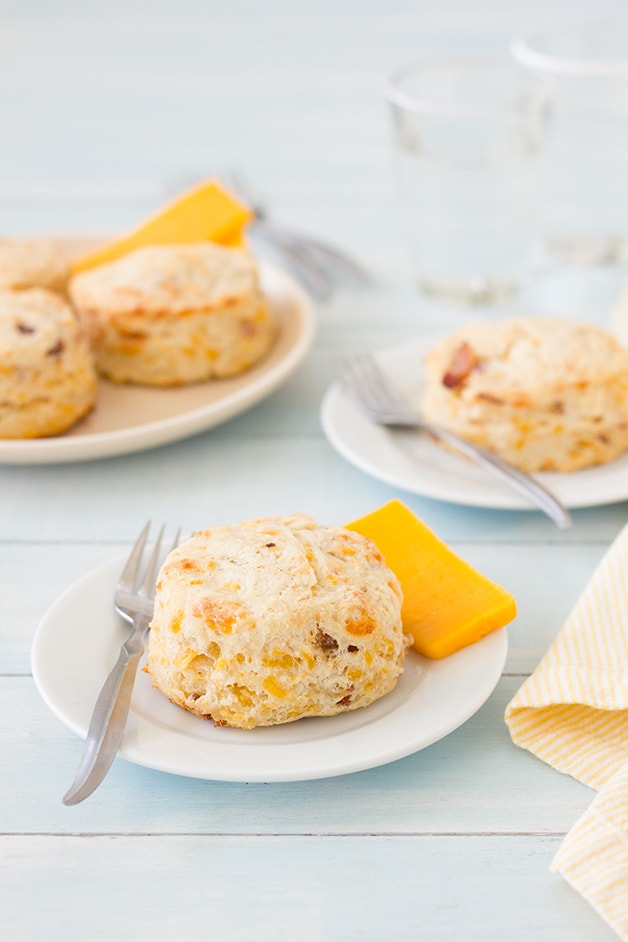 Bacon Cheddar Scones -Flaky, buttery scones flecked with bits of tangy cheddar and crisp bacon. | www.brighteyedbaker.com