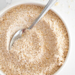 Close up of homemade oat flour in a bowl.