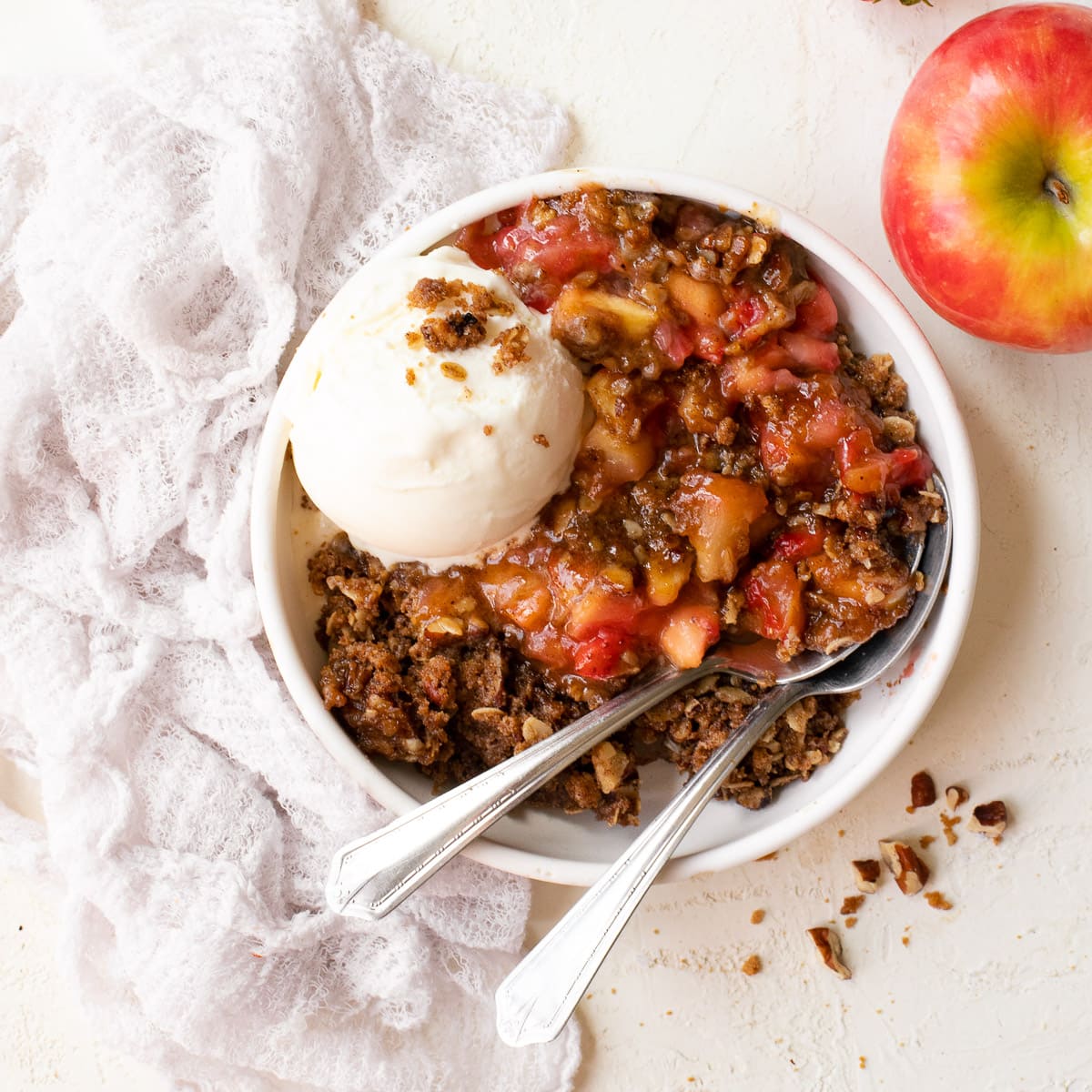Strawberry Apple Crumble - a wam, nutty crumble that combines juicy summer berries with crisp fall apples in the best way possible. | www.brighteyedbaker.com