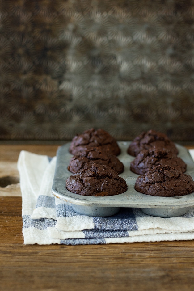 Light and tender double chocolate muffins made healthier with NO white flour, coconut oil, and just enough brown sugar for sweetness  -- a chocolatey treat without the guilt. {Dairy-Free} | www.brighteyedbaker.com