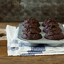 Light and tender double chocolate muffins made healthier with NO white flour, coconut oil, and just enough brown sugar for sweetness -- a chocolatey treat without the guilt. {Dairy-Free} | www.brighteyedbaker.com