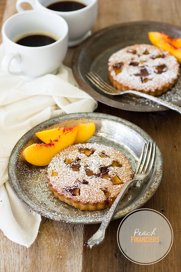 Peach Financiers - classic French brown butter teacakes with slightly crisp edges and a perfectly soft and moist crumb, filled with a nutty sweet flavor and juicy fresh peaches. | www.brighteyedbaker.com