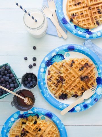 Blueberry Waffles - A simple recipe for gluten-free, dairy-free waffles with crispy edges, fluffy centers, and plenty of fresh summer berries!
