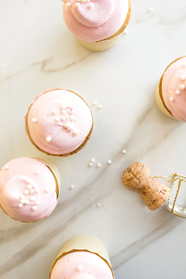 Vanilla Bean & Almond Cupcakes with Roasted Raspberry Swiss Meringue Buttercream - Soft, tender, and light vanilla cupcakes topped with a dreamy, silky-smooth raspberry buttercream. A classy dessert for spring and summertime entertaining!