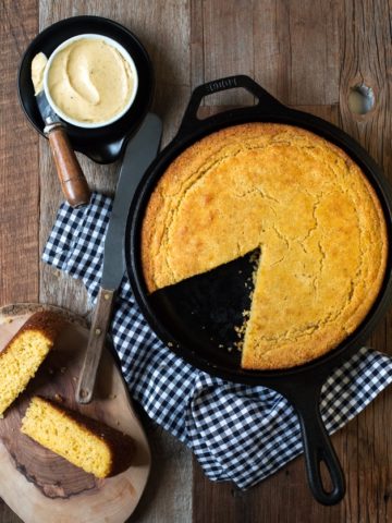 Soft and tender gluten-free cornbread with a crispy golden crust, speckled with flecks of vanilla bean.