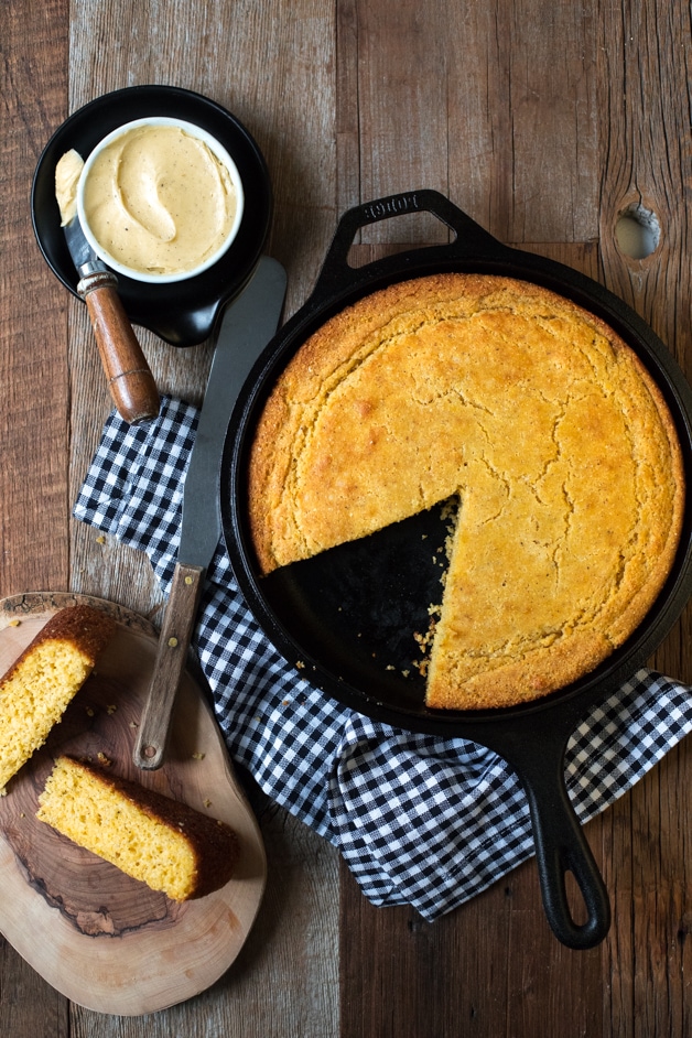 Soft and tender gluten-free cornbread with a crispy golden crust, speckled with flecks of vanilla bean.