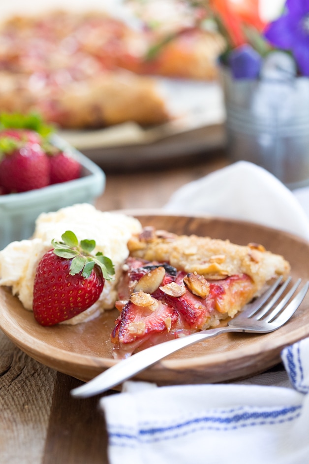 A butter, flaky galette with a juicy strawberry-peach filling and a crispy almond-speckled crust.