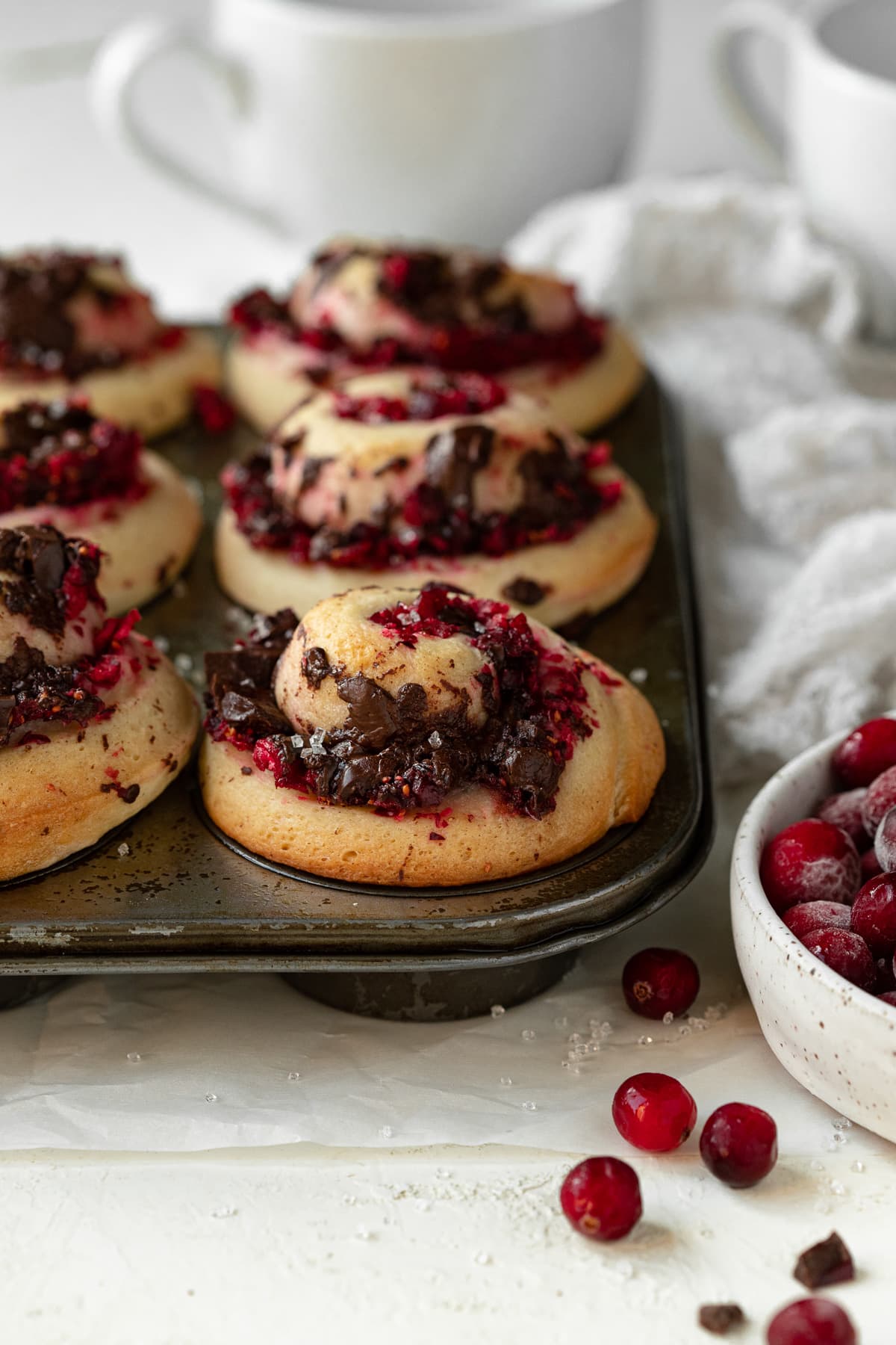 Sweet rolls filled with a cranberry-chocolate mixture, baked in a muffin pan.