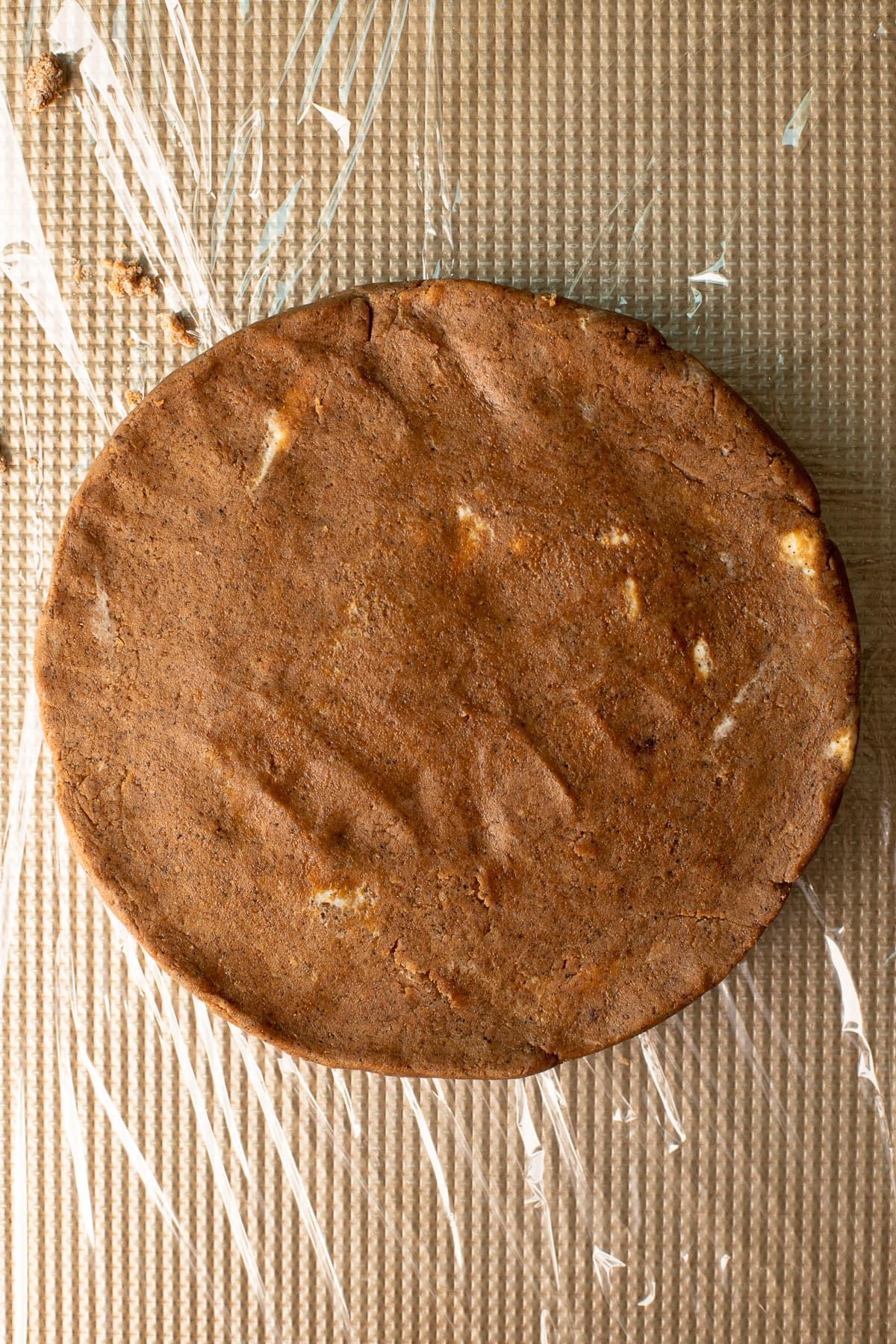 Coffee scone dough shaped into a disc on a baking sheet.