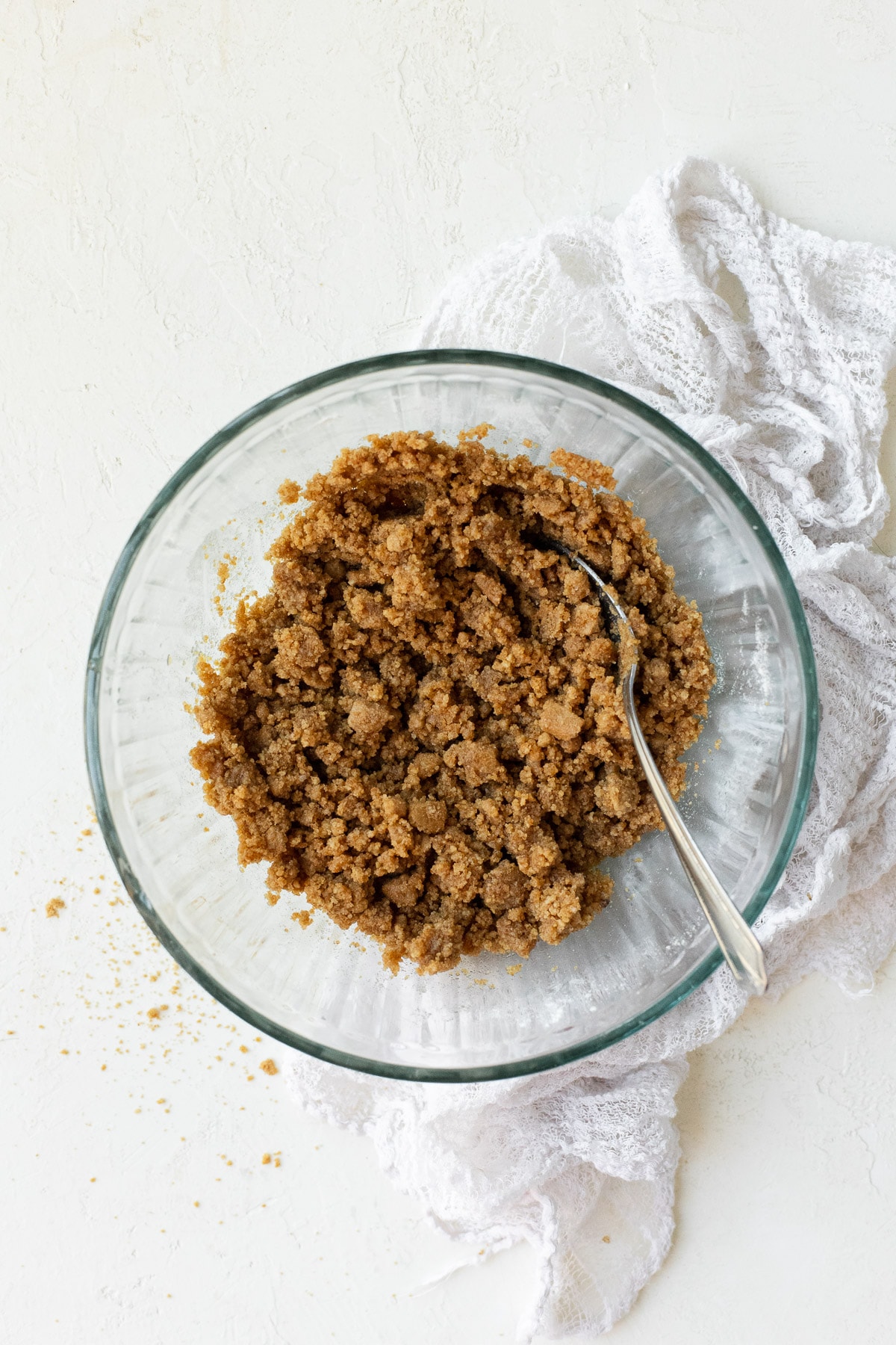 A bowl filled with graham cracker crumble mixture.