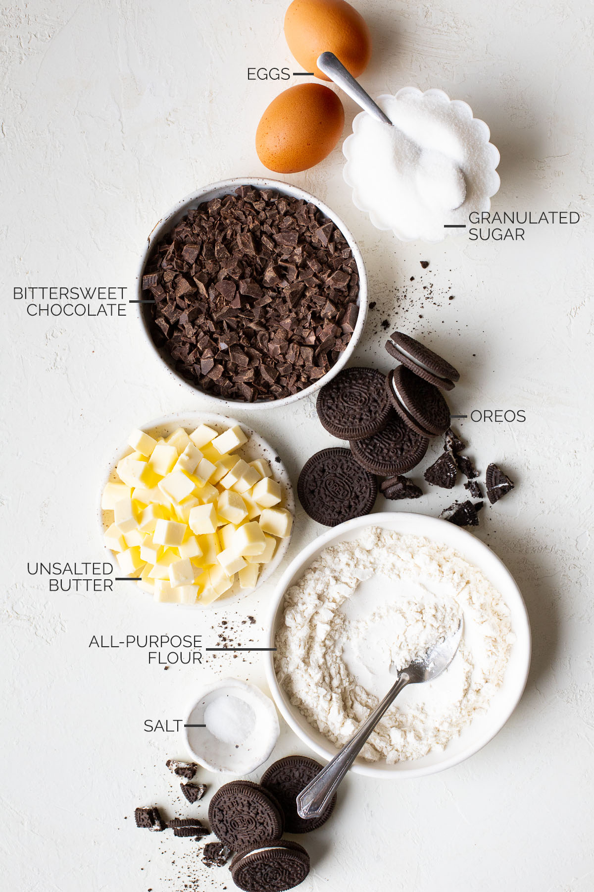 Eggs, flour, chocolate, Oreos, butter, sugar, and salt for Oreo brownies.