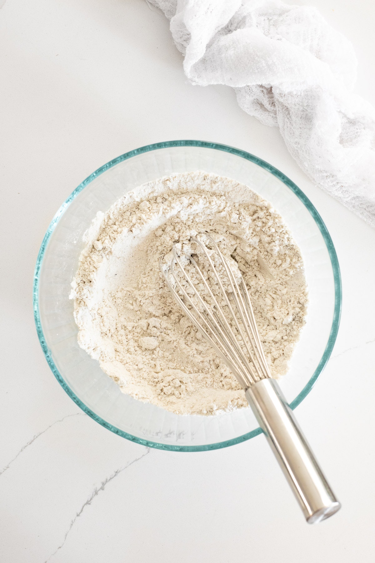 Dry ingredients for coffee cake whisked together in a bowl.