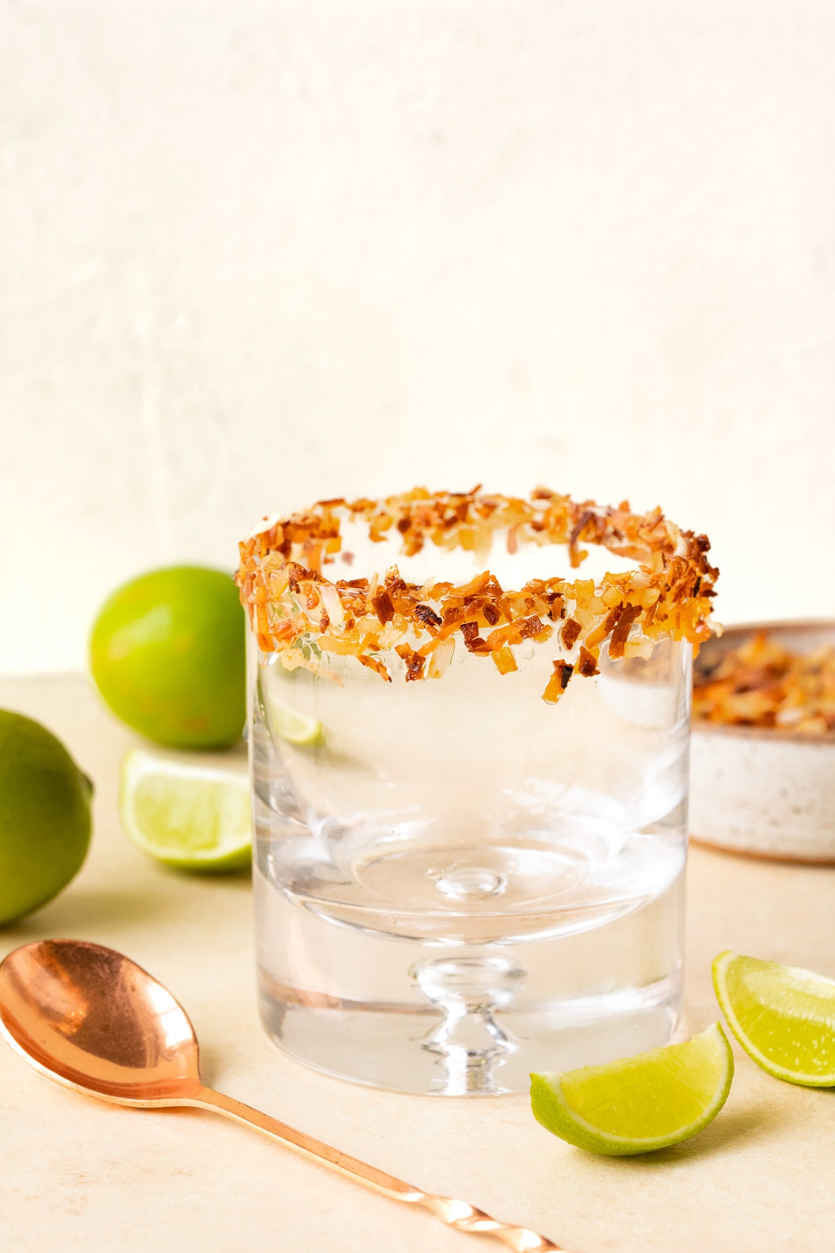 Rocks glass with toasted coconut rim.