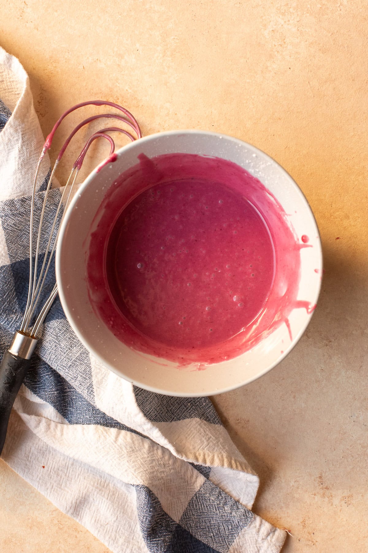 Blackberry drizzle for muffins mixed in a small bowl.