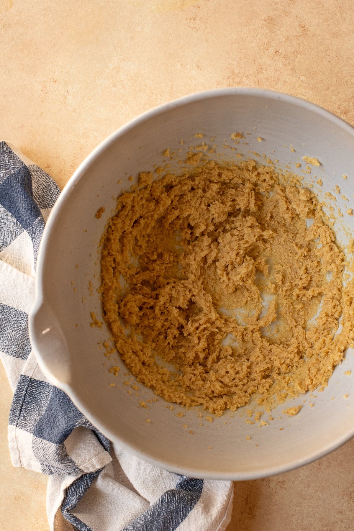 Butter and sugar creamed together in a large mixing bowl.