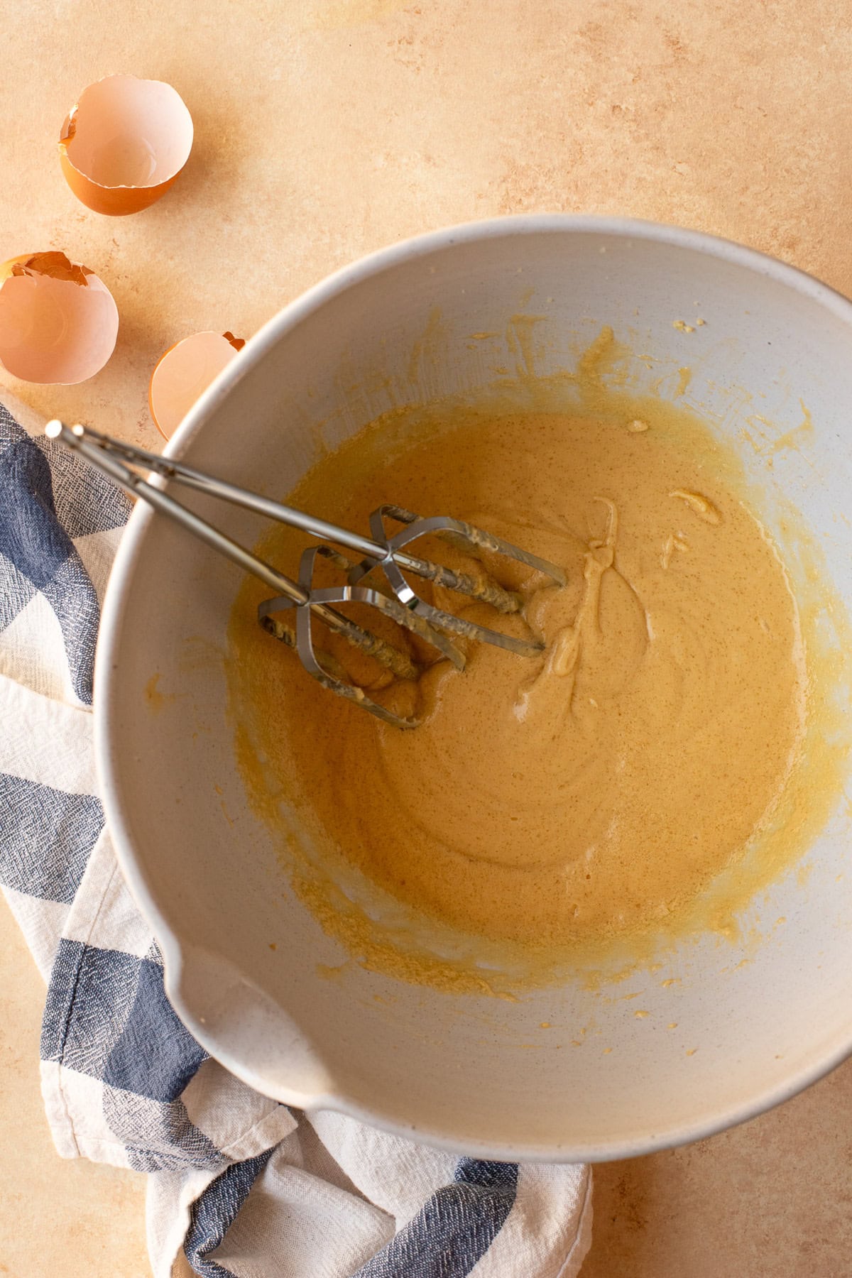 Eggs whipped into butter and sugar along with vanilla extract and lemon zest.