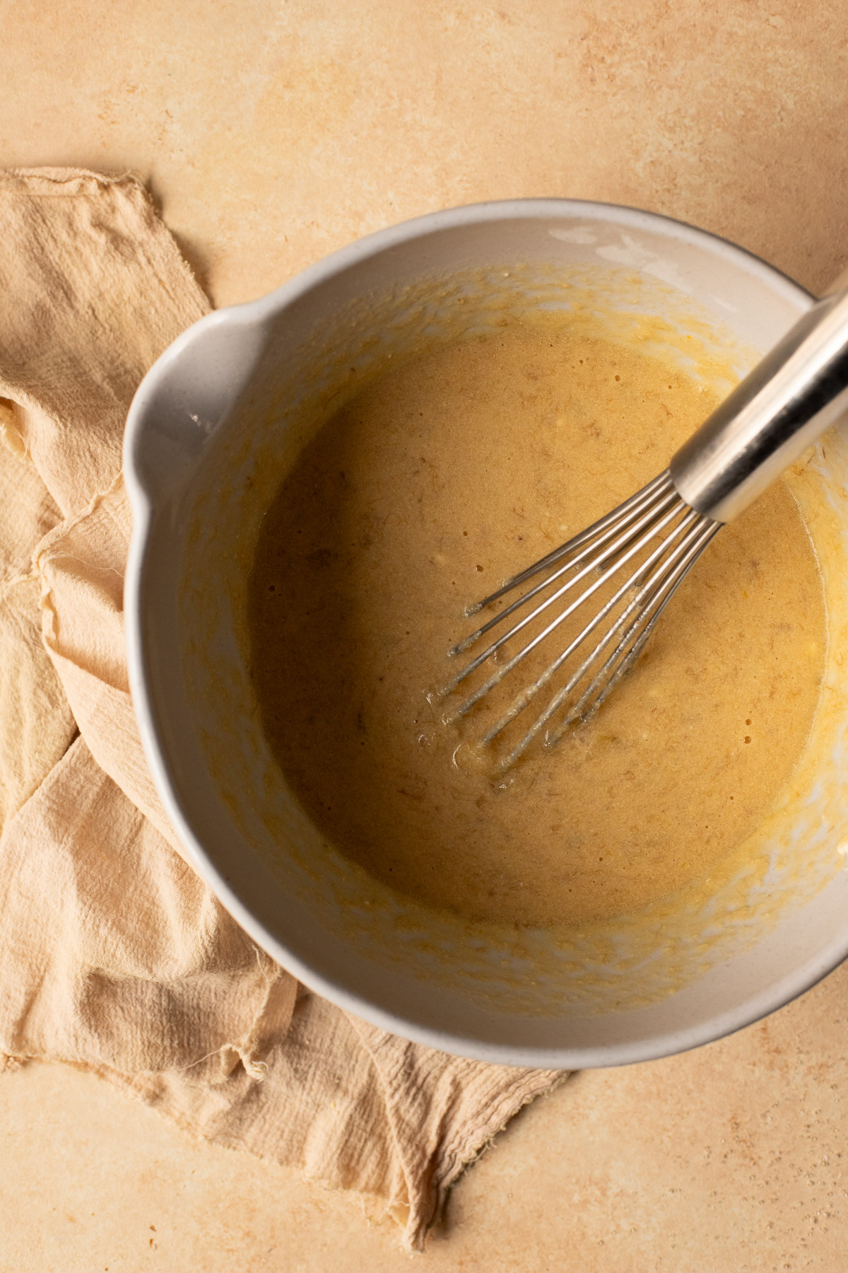 Mashed bananas and yogurt mixed into melted butter, sugar, and eggs.